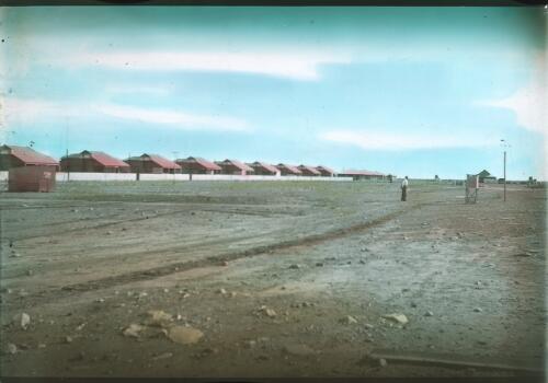 Row of unidentified dwellings [transparency] : scenes from the Gulf Patrol and other general scenes / [John Flynn?]
