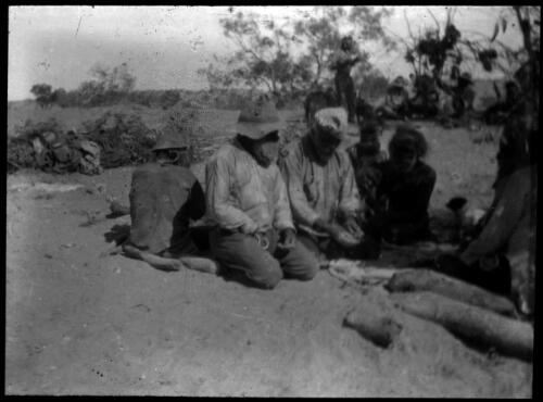 Group of unidentified Aboriginal men [transparency] : scenes from the Gulf  Patrol and other general scenes / [John Flynn?]