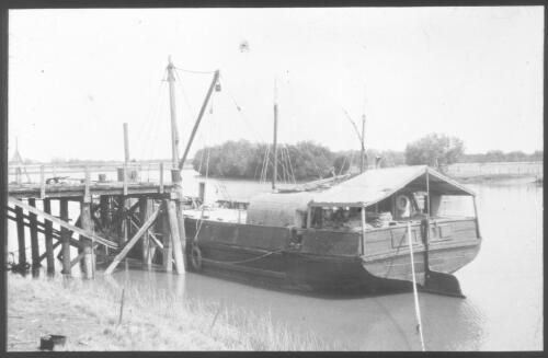 Unidentified boat moored by a wharf [transparency] : scenes of Tennant Creek and the Northern Territory, Beltana, Oodnadatta, and other general scenes / [John Flynn?]