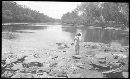Unidentified woman wading in water at Roper Bar on the Roper River [transparency] : scenes of Tennant Creek and the Northern Territory, Beltana, Oodnadatta, and other general scenes / [John Flynn?]