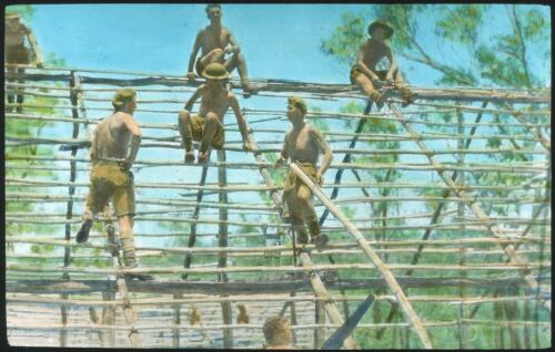 Unidentified Australian Army soldiers constructing timber framework of a building [transparency] : scenes of Army life in Australia during World War II / [John Flynn?]