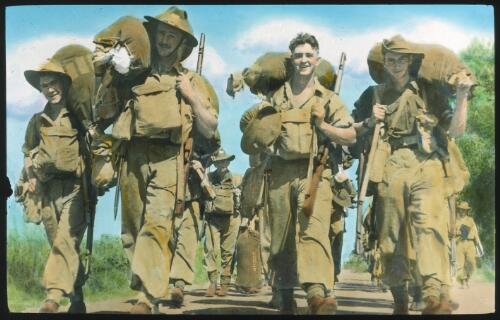Unidentified Australian Army soldiers marching with full kits [transparency] : scenes of Army life in Australia during World War II / [John Flynn?]