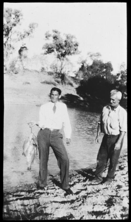 Two men with a string of fish [transparency] / [John Flynn?]