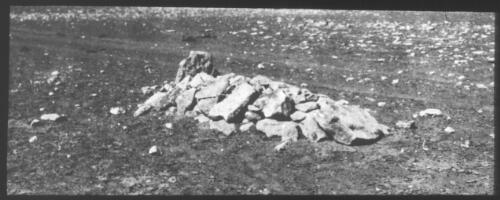 Unidentified rock covered grave [transparency] / [John Flynn?]
