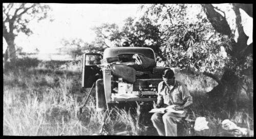 Reverend Fred McKay working from the back of his patrol truck [transparency] / [John Flynn?]