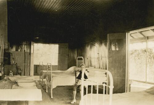 Unidentified child in an Australian Inland Mission ward [picture] : general AIM scenes / [John Flynn?]