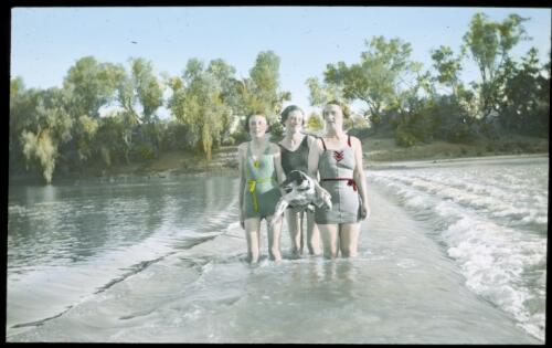 Three unidentified women standing in the Fitzroy River while it was receding, Western Australia [transparency] : scenes from the North Australia Patrol and other general scenes, 1937-1942 / [John Flynn?]