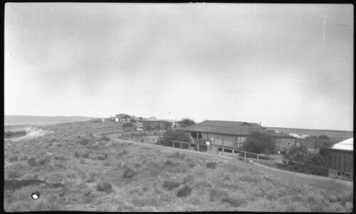 Looking down on the Port Hedland nursing home from a hill [picture] : taken on a survey trip undertaken in 1927 by Rev. J.A. Barber and Dr. George Simpson for the Flying Doctor Scheme, Western Australia, 1927 / [J.A. Barber and George Simpson]
