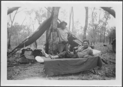 Stockman holding the horn with which he was gored, musterers' camp near Dunbar, Queensland [picture]  / [John Flynn?]