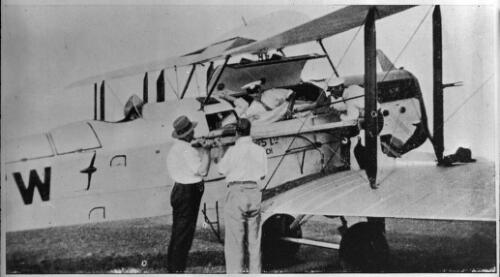 A patient being removed from the plane at Cloncurry [picture] : general AIM scenes / [John Flynn]