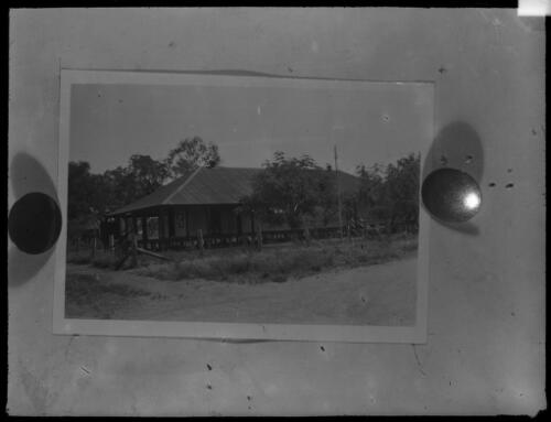 Unidentified building surrounded by trees, [Darwin?] [picture] : Darwin and other general scenes / [John Flynn?]