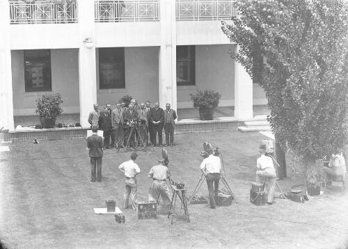Joseph Lyons meeting the press at Parliament House after the swearing in ceremony, Canberra, 1932 [picture] / A. Collingridge