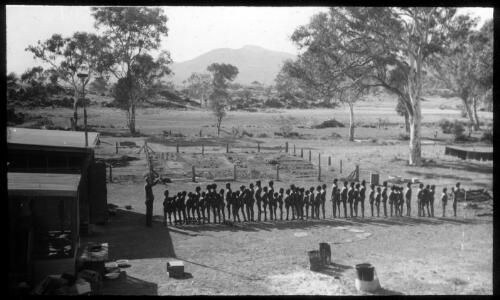 Ernabella School, children in line outside the school house, South Australia, 1946 [transparency] / C. Duguid
