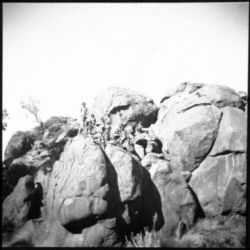Group of people on a rocky hillside, Australia, 1946 [transparency] / C. Duguid