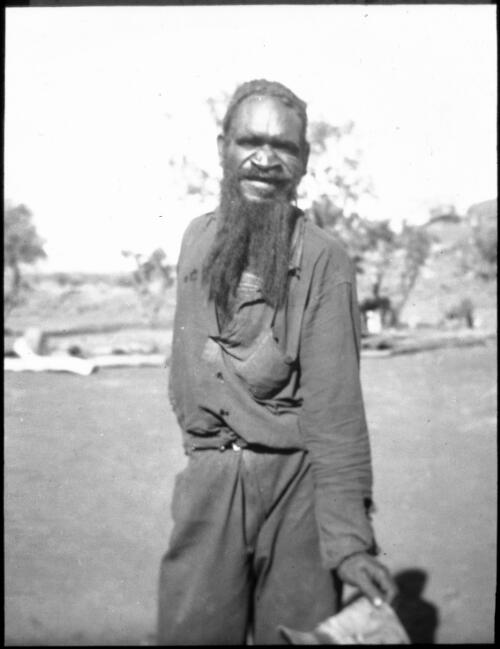 Bearded man carrying his hat at Ernabella, South Australia, 1935 [transparency] / C. Duguid