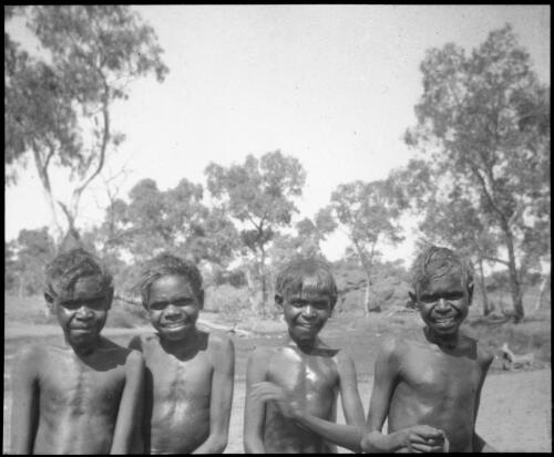 Portrait of four boys from Ernabella School, South Australia, 1946 [transparency] / C. Duguid