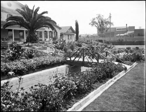 Front view of the AWA [i.e. Amalgamated Wireless Australasia] building with garden beds in the foreground, Sydney New South Wales [picture] / A.G. Foster