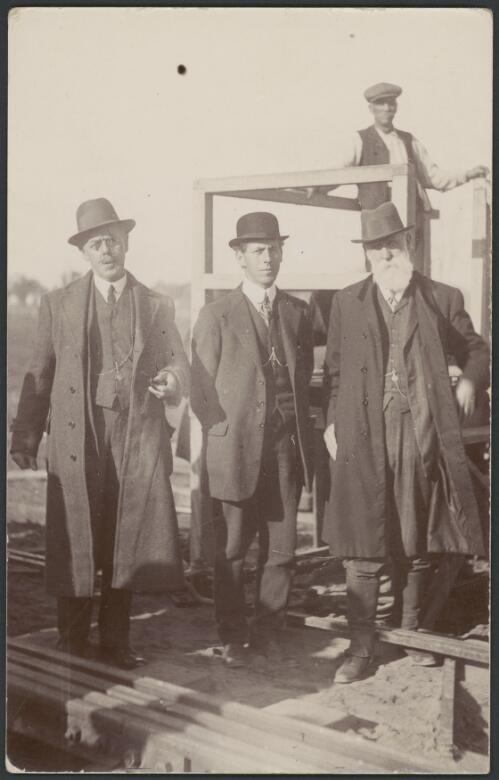 Henry Deane, on right, with three unidentified men at the third rail test, Tocumwal, New South Wales, 1915 [picture] / H.A. Herberte