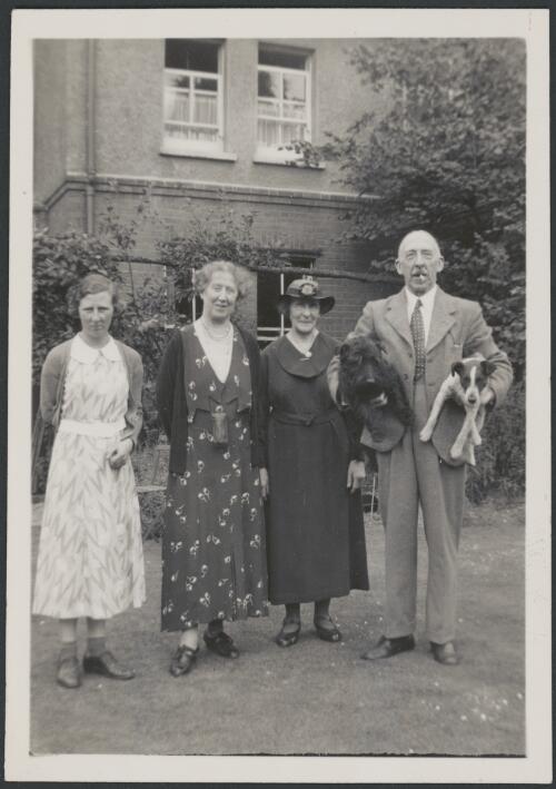 Group portrait of Miss A.M. Deane [?], second from right, with Henry J. Deane and his wife and daughter, 1937 [picture]