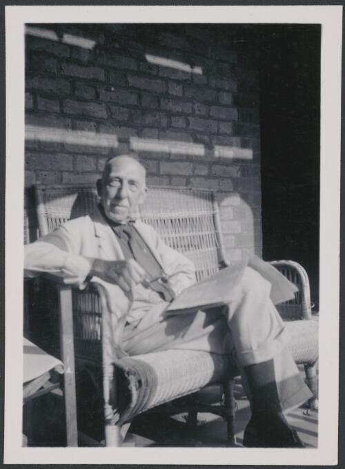 Portrait of Henry J. Deane with newspaper, 1947 [picture]