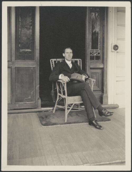 Portrait of Geoffrey Paget Deane [?] seated in a doorway, ca. 1920s [picture]