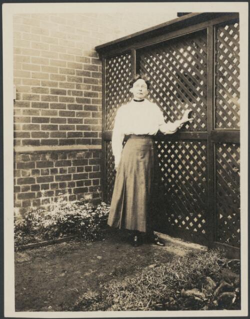 Portrait of Mathilde Elizabeth Deane near a lattice gate, Malvern, Victoria, 1918 [picture]