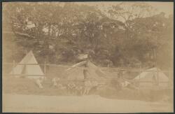 Group portrait of nine unidentified men in front of three tents, two ...