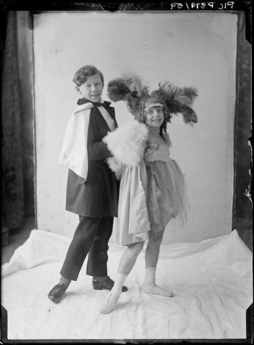 Young boy and girl posing in fancy dress [picture] / Arthur William Emmerton