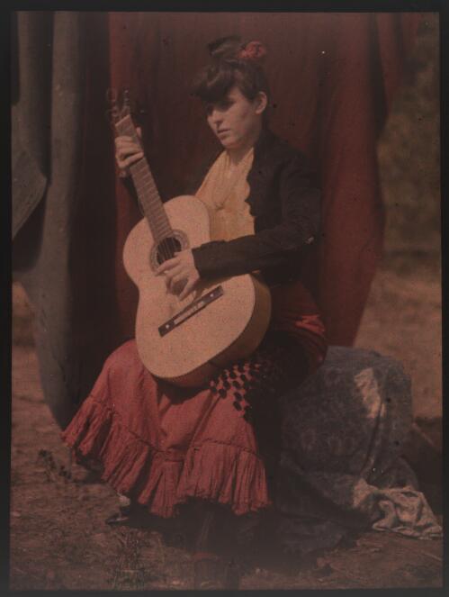 [Portrait of Jean Lindsay seated with guitar, ca. 1906] [transparency]