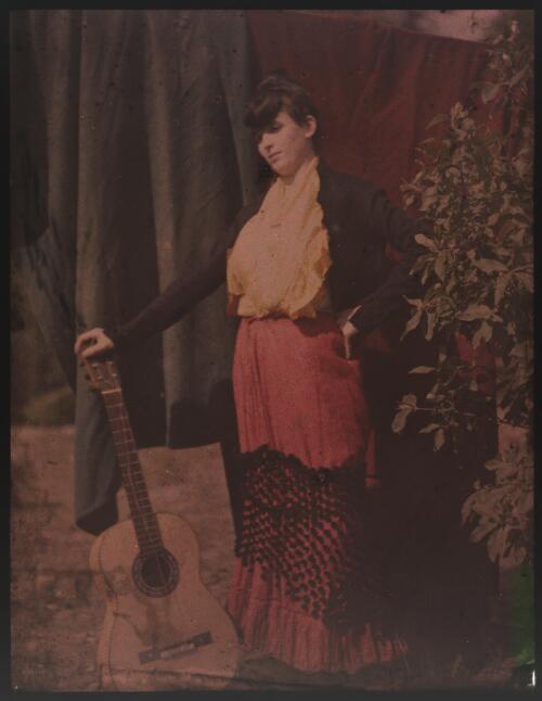 [Portrait of Jean Lindsay standing with guitar, ca. 1906] [transparency]