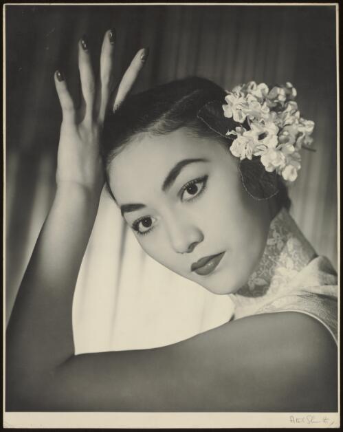 Asian model with flowers in her hair [picture] / Athol Shmith