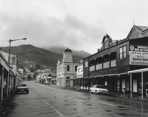 Streetscape Orr Street, Queenstown. Hunters Hotel in right foreground, Post Office right mid ground, and Salvation Army Hostel on left hand side. Originally the Queenstown Hotel, Salvation Army Hostel now called 'Affinity House' [picture]