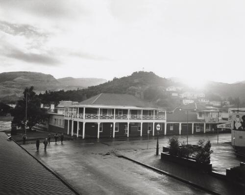 Early morning view of Mt. Lyell. Motor Inn (originally Harvey's Hotel built in 1896) on Orr Street from Empire Hotel, Queenstown. Spion Kop Hill lookout behind Motor Inn [picture]