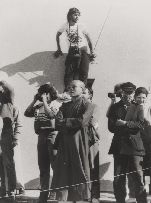 An odd assortment of people along the north wall of the opening ceremony, Canberra, 1988 [picture] / Kate Callas
