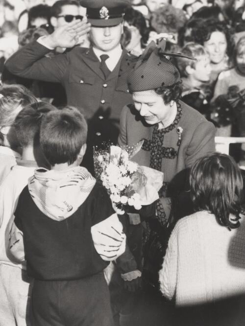 The Queen accepting flowers from children at Fairbairn, Canberra, 1988 [picture] / Andrew Campbell