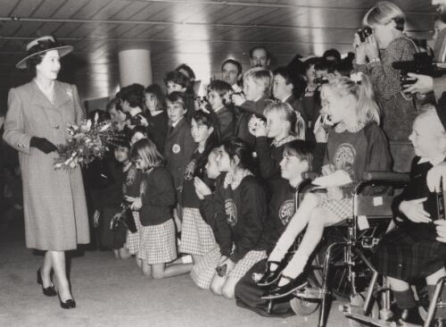 The Queen meets with children from Bradon Park Primary School, Victoria, when she toured inside Parliament House, Canberra, 1988 [picture] / Martin Jones