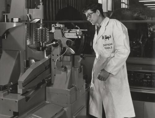 Sutton Tools employee attending metal lathe, Clifton Hill, Melbourne, 1960, 1 [picture] / Wolfgang Sievers