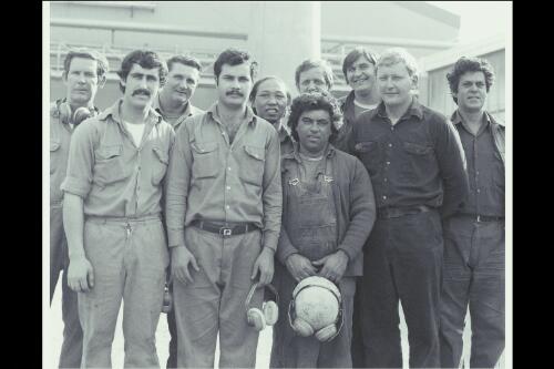 Australian workers of various ethnic backgrounds [two rows of male workers] 1983, Australian Glass manufacturers Spotswood, Melbourne [picture] / Wolfgang Sievers