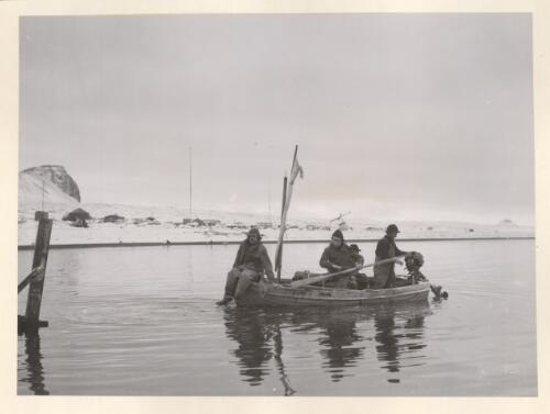 Four men aboard a 10 ft. [i.e foot] dinghy at Atlas Cove camp heading for Saddle Point, Heard Island, Antarctica, 1948 [picture] / A. Campbell-Drury