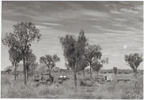 Two jeeps approaching Ayers Rock, Northern Territory, 1948 [picture] / Gurth Kimber