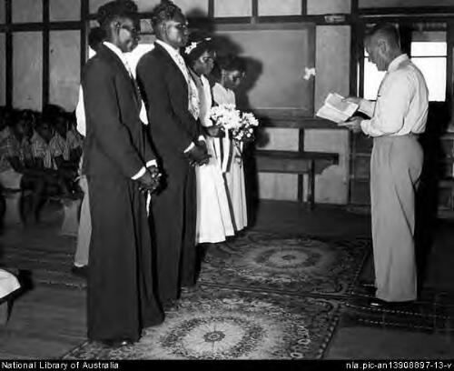 Wedding ceremony held by the Methodist [i.e. Presbyterian] minister at Weipa,  Cape York, North Queensland, 1957 [picture] / Wolfgang Sievers