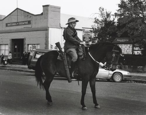 Neale Lavis, former Olympic equestrian riding his mare 'Drift' in the uniform of the 7th Light Horse Regiment in the Anzac Day march, Braidwood, New South Wales, April 1997 [picture] / Terry Milligan