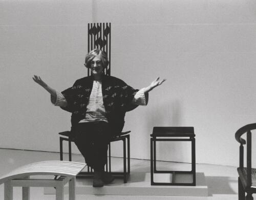 Pru Shaw, woodworker and furniture maker showing a chair made from wenge, jasper and glass at an exhibition at the Craft Council of ACT building, Canberra, June 1997 [picture] / Terry Milligan