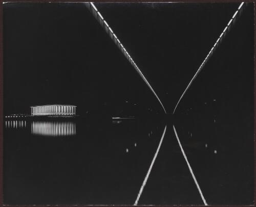 [National Library of Australia at night from beneath Commonwealth Avenue Bridge near Regatta Point, Canberra, 1968] / Max Dupain