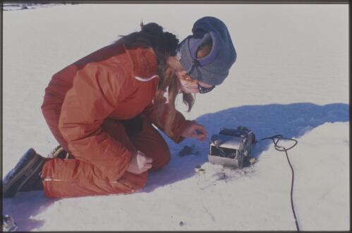 Biologist Suzy Rea uses an Eckman sediment grabber to take surface sediment samples from lakes around Davis Station, Antarctica, 16 November 1997 [transparency] / Felicity Jenkins