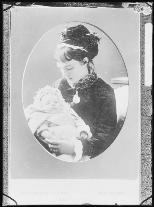 Emily Cazneau wearing a hat and holding baby Harold [picture] / Harold Cazneaux