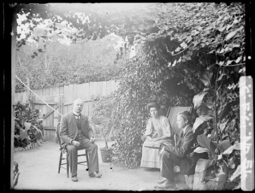 Winifred Cazneaux, Prescott Cazneaux and his son Fergus sitting in backyard, North Sydney, ca. 1906 [picture] / Harold Cazneux