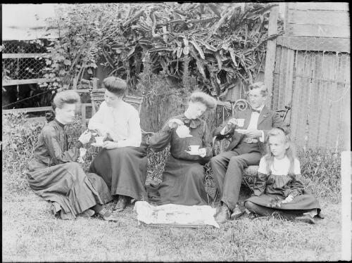 Peisley family gathered at a tea party in a backyard, Sydney, ca. 1900s [picture] / Harold Cazneux