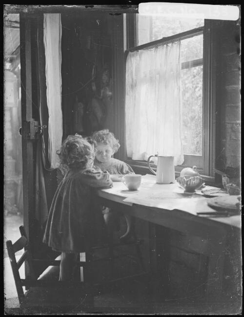 Jean and Rainbow Cazneaux in the kitchen, Riley Street, North Sydney, 1911 [picture] / Harold Cazneaux