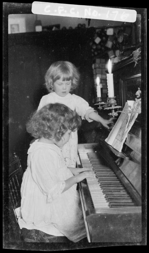 Rainbow and Beryl Cazneaux at the piano, 1914? [picture] / Harold Cazneaux